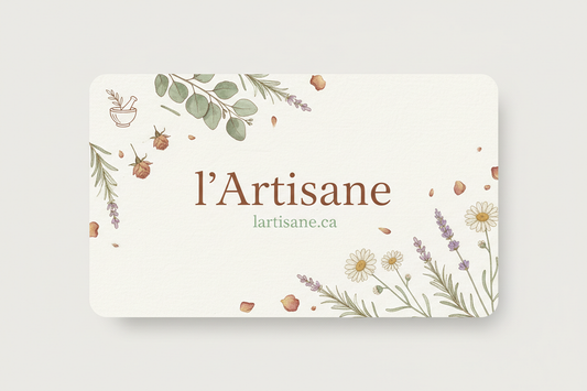 Create an elegant gift card design for the artisanal herbal shop 'l’Artisane'. Include natural botanical elements like leaves, dried flowers, and herbs. Use soft, earthy colors such as light green, beige, cream, and brown accents. Modern and clean layout, featuring only the shop name 'l’Artisane' and the website URL 'lartisane.ca'. Include a small herbalist logo or symbol (e.g., mortar and pestle). High-resolution, sharp, and clear image suitable for digital and print use. No other text.